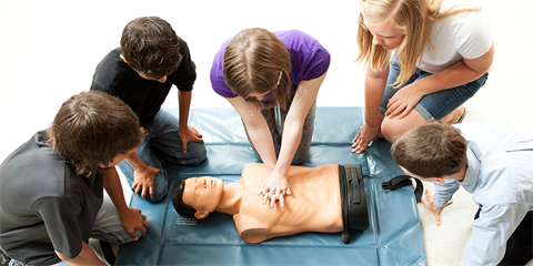 CPR training with a group of teenagers